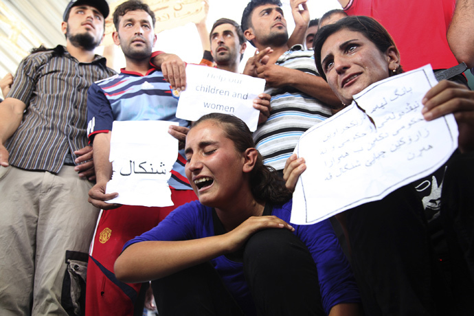 Displaced demonstrators from the minority Yazidi sect gather during a protest against militants of the Islamic State, formerly known as the Islamic State in Iraq and the Levant (ISIL), in Arbil, north of Baghdad (Reuters / Azad Lashkari)