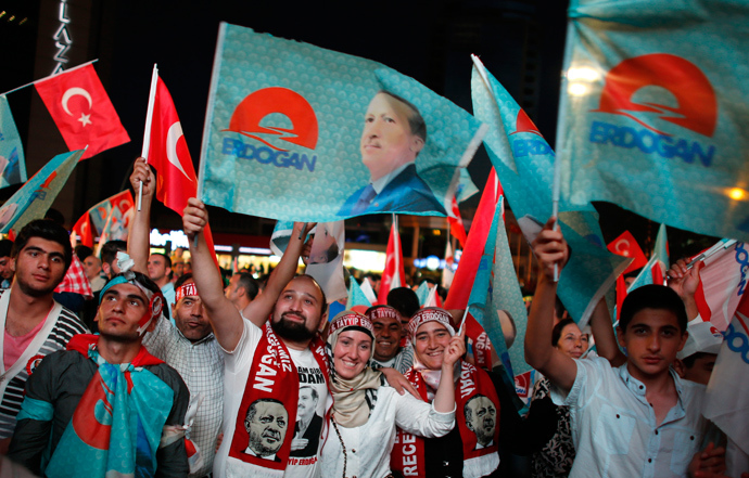 Supporters of Turkey's Prime Minister Tayyip Erdogan celebrate his election victory in front of the party headquarters in Ankara August 10, 2014 (Reuters / Umit Bektas)