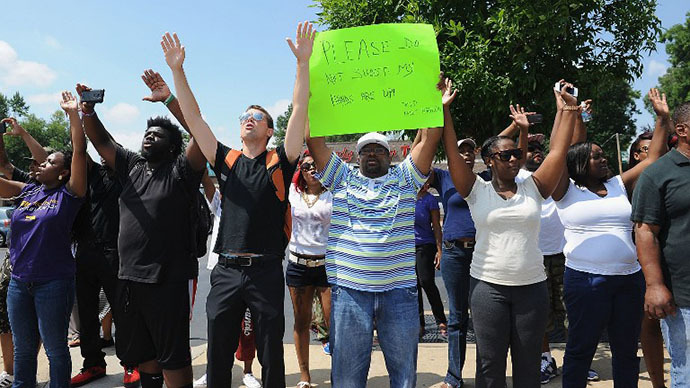 Police teargas crowds protesting killing of Missouri teenager