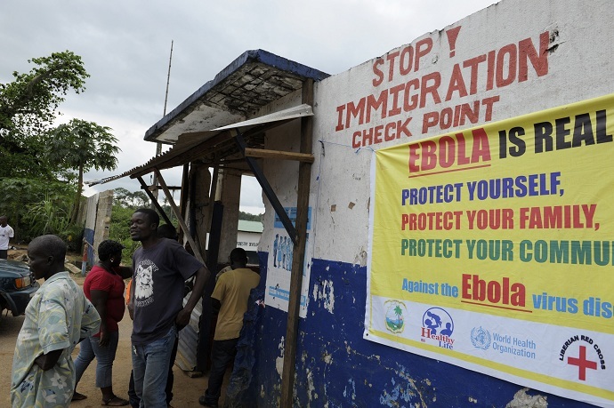 Liberian soldiers check people travelling in Bomi County. Liberian troops set up Ebola roadblocks and stopped public access to some of the worst-hit towns after the country declared a state of emergency to tackle the worst outbreak of the disease on record. (Reuters/Stringer)