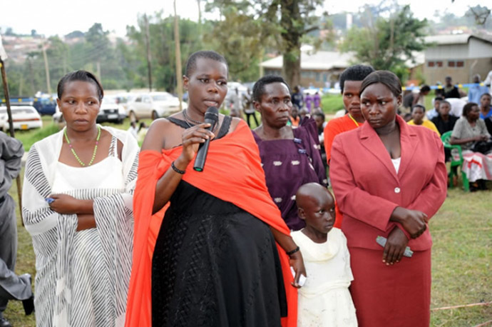 Gloria Tumwijuke (with microphone), Alice Ngonzi Isoke (folding hands in red dress), Diana Alinaitwe (behind Alice), Mrs Isoke (Aliceâs mother), an unidentified health worker(on Gloriaâs right) and a granddaughter to Mrs Isoke â all Ebola survivors narrating their ordeal at Kagaadi Hospital during the function to officially declare Uganda Ebola free (Photo from www.afro.who.int)