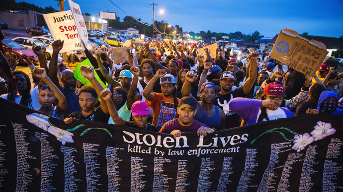 One shot, 7 arrested as Ferguson police disperse protesters defying curfew