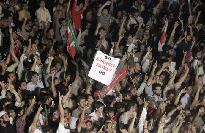 Supporters of Imran Khan, cricketer-turned-opposition politician and chairman of the Pakistan Tehreek-e-Insaf (PTI) political party, chant slogans while listening to their leader during the Freedom March in Islamabad August 17, 2014. (Reuters/Faisal Mahmood)