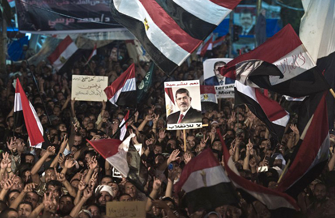 A file picture taken on August 12, 2013 shows members of the Muslim Brotherhood and supporters of Egypt's ousted president Mohammed Morsi as they take part in a sit-in protest outside the Rabaa al-Adawiya mosque in Cairo. (AFP Photo / Khaled Desouki)