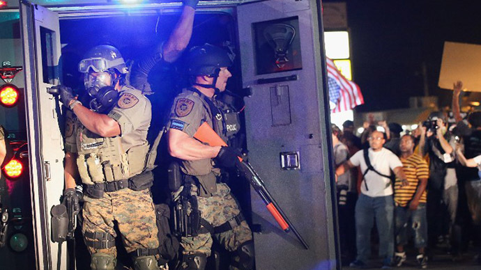 Police attempt to control demonstrators protesting the killing of teenager Michael Brown on August 18, 2014 in Ferguson, Missouri. (AFP Photo / Getty Images / Scott Olson)