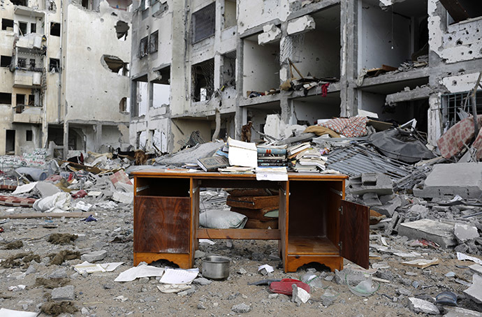 A desk sits amid the debris of buildings destroyed by what police said were Israeli airstrikes and shelling in the town of Beit Lahiya in the northern Gaza Strip (Reuters / Finbarr O'Reilly)