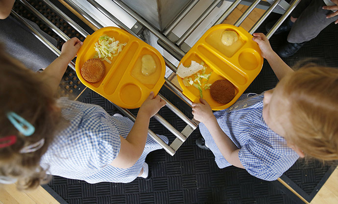 Students receive their lunch at Salusbury Primary School in northwest London (Reuters / Suzanne Plunkett)