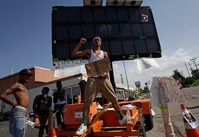 Demonstrators protest the shooting of Michael Brown in Ferguson, Missouri August 23, 2014 (Reuters / Joshua Lott)