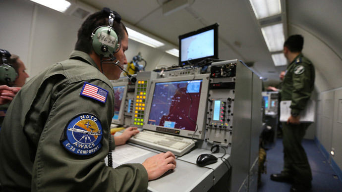 A controller monitors at screens aboard a NATO AWACS.(Reuters / Francois Lenoir)