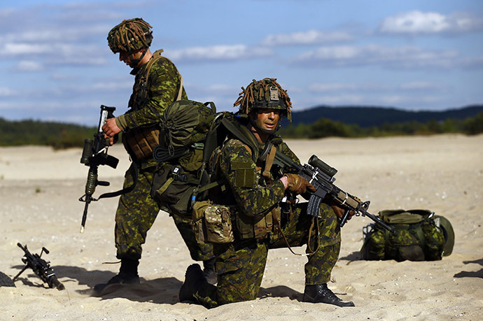 Troops from Canada's 3rd Division, composed with a platoon of 3rd Battalion and Princess Patricia's Light Infantry, participate at a NATO-led exercise "Orzel Alert" held together with the U.S. Army's 173rd Infantry Brigade Combat Team and Poland's 6th Airborne Brigade in Bledowska Desert in Chechlo, near Olkusz, south Poland May 5, 2014. (Reuters / Kacper Pempel)