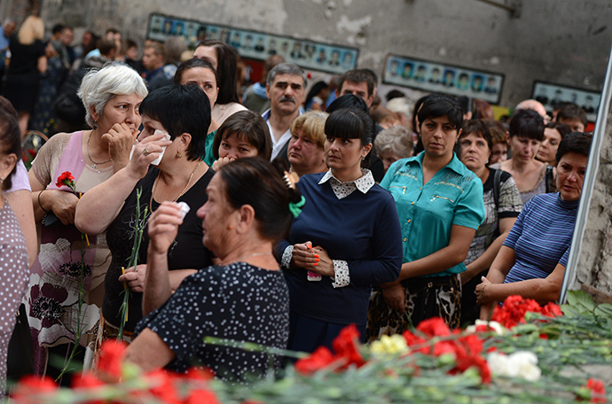 Local residents at a commemorative event marking 10 years since the Beslan school siege at the memorial to the victims of the terrorist attack on September 1, 2004. (RIA Novosti / Evgeny Biyatov)