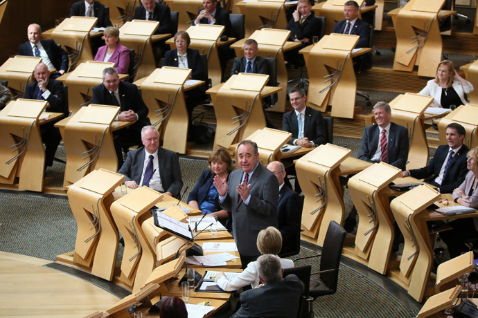 Scotland's First Minister, Alex Salmond (STANDING), addresses Members of the Scottish Parliament (MSP), during First Minister's Question Time, the last before Scotland votes in a referendum on independence, in Edinburgh August 21, 2014. (Reuters/Paul Hackett) 