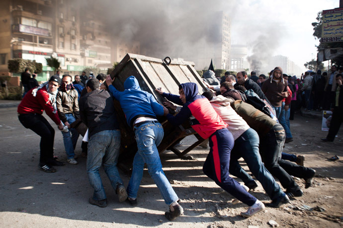 Supporters of ousted Mohamed Morsi block a street during clashes with Egyptian security forces in Nasr City, Cairo on January 8, 2014.(AFP Photo / Virginie Nguyen Hoang )