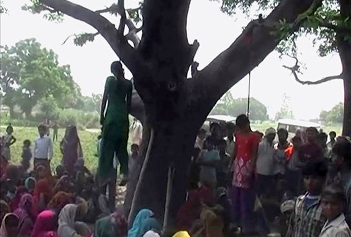 Two girls are seen hanging from a tree in a village in the northern Indian state of Uttar Pradesh on May 28, 2014, in this still image taken from video. (Reuters)