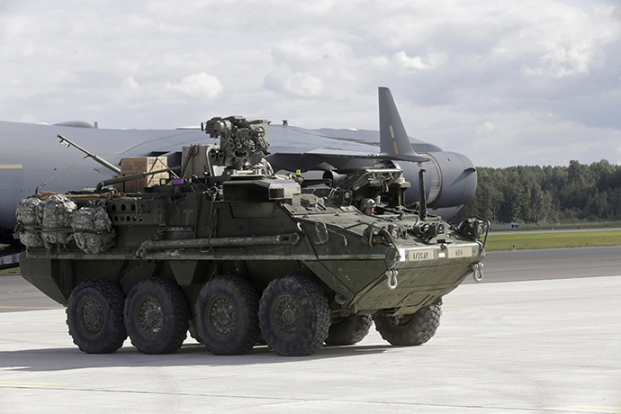 U.S.173 airborne brigade soldiers arrive in armoured personal carrier "Stryker" for the "Steadfast Javelin II" military exercise in the Lielvarde air base, September 6, 2014. (Reuters / Ints Kalnins)