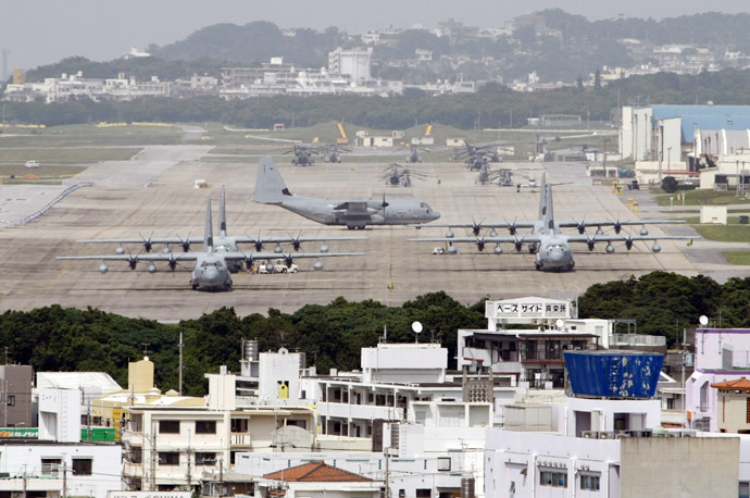 Hercules aircraft are parked on the tarmac at Marine Corps Air Station Futenma in Ginowan on Okinawa May 3, 2010. (Reuters/Issei Kato)