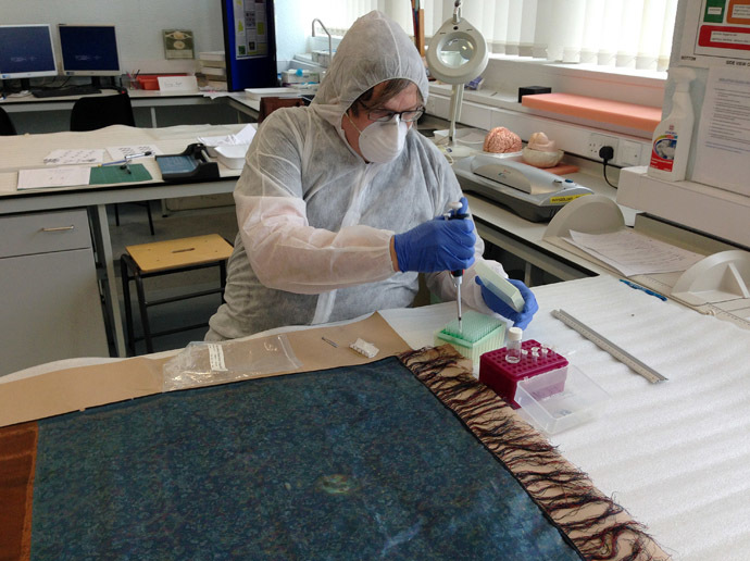An undated handout photograph obtained in London on September 7, 2014, shows Dr Jari Louhelainen, senior lecturer at Liverpool John Moores University, testing a shawl that was taken from the murder scene of Jack the Ripper's fourth victim Catherine Eddowes on September 30, 1888. Jack the Ripper, one of the most notorious serial killers in history, has been identified through DNA traces found on a shawl, claims a sleuth in a book to be published Tuesday. (AFP Photo)