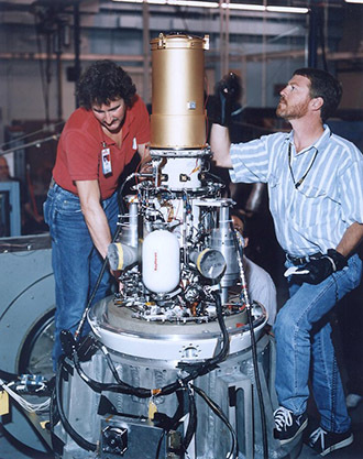 This undated file photo released by the Pentagon shows two unidentified workers with the exoatmospheric kill vehicle (EKV), a missile interceptor that is part of an anti-missile defense system. (AFP Photo)