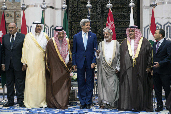 US Secretary of State John Kerry stands amid his counterparts from Egypt, Kuwait, Saudi Arabia, Bahrain and Lebanon during a family photo at King Abdulaziz International Airportâs Royal Terminal in Jeddah September 11, 2014. (Reuters/Brendan Smialowski)