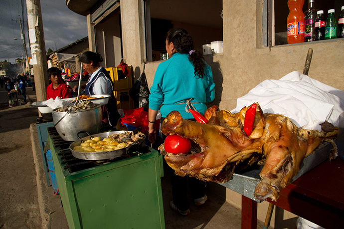 Vendors sell pork and potatoes in San Pedro, Cayambe, some 46 km (28.6 miles) north of Quito (Reuters / Guillermo Granja)