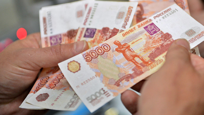 Ruble hits record low as West waits for Russia's response to sanctions, oil recedes