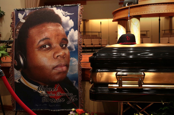 A baseball cap and a portrait of Michael Brown is shown alongside his casket inside Friendly Temple Missionary Baptist Church before the start of funeral services in St. Louis, Missouri (Reuters / Robert Cohen / Pool) 