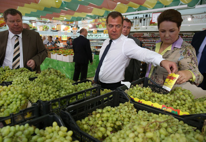 Russian Prime Minister Dmitry Medvedev, center, visits a Magnit supermarket in the town of Korenovsk. Left: Vladimir Ustinov, Russian plenipotentiary presidential representative in the Southern Federal District. (RIA Novosti/Ekaterina Shtukina)