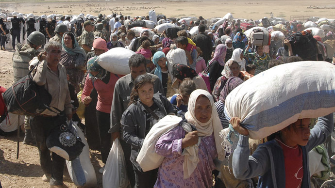 60,000 Syrian Kurds flee to Turkey within 24 hours amid ISIS advance