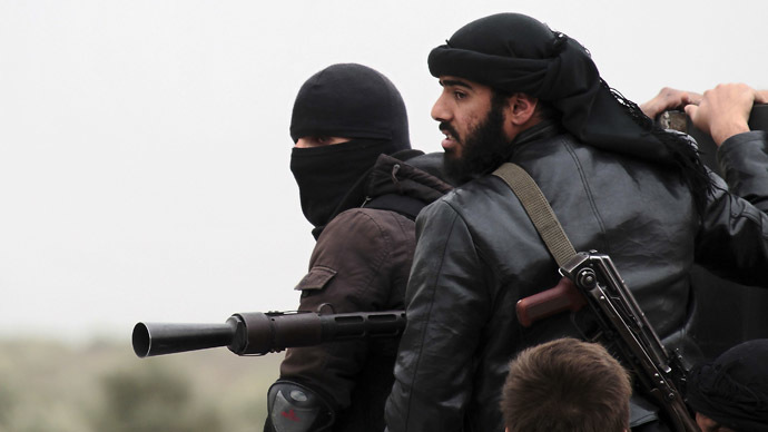 Fighters of the jihadist group Al-Nusra Front stand on the top of a pick-up mounted with a machine gun during fightings against the regime forces on April 4, 2013 in the Syrian village of Aziza, on the southern outskirts of Aleppo. (AFP Photo)