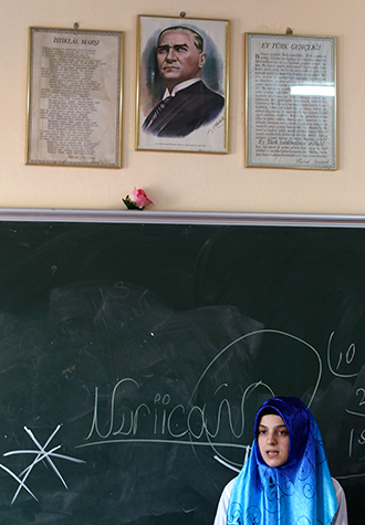 A portrait of the founder of the Turkish Republic, Mustafa Kemal Ataturk, hangs above a blackboard at the Kazim Karabekir Girls' Imam-Hatip School in Istanbul (Reuters / Murad Sezer)