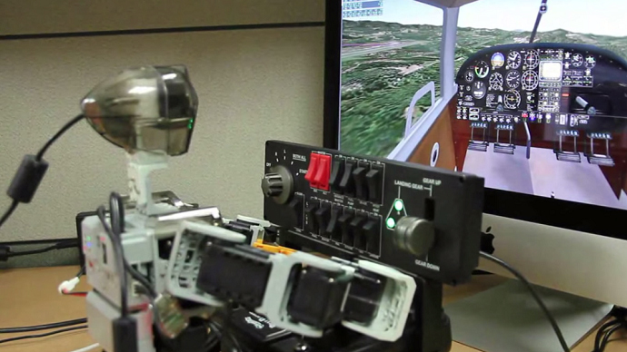 Humanoid pilot: PIBOT, a toy-sized robot, learns how to fly a real plane (VIDEO)