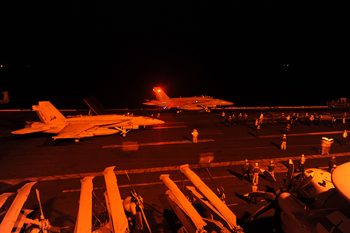 This US Navy photo shows an an F/A-18E Super Hornet, attached to Strike Fighter Squadron (VFA) 31, and an F/A-18F Super Hornet, attached to Strike Fighter Squadron (VFA) 213, as they prepare to launch from the flight deck of the aircraft carrier USS George H.W. Bush (CVN 77)to conduct strike missions against ISIL targets on September 23, 2014 in the Gulf. (AFP Photo / US Navy / Robert Burck / Habdout)