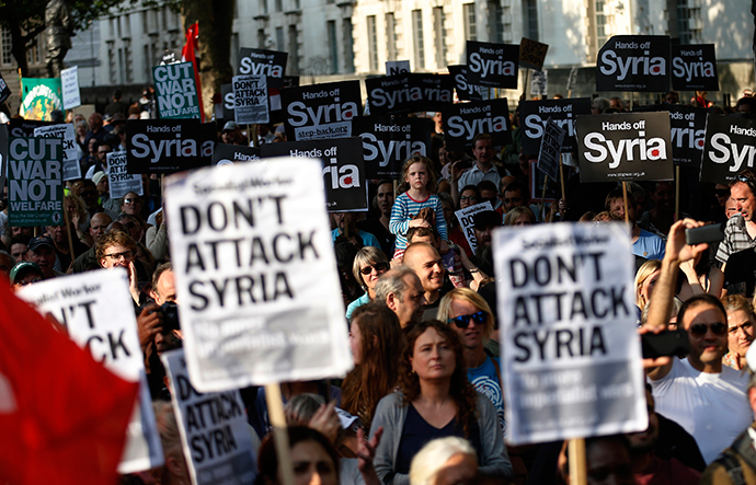 ARCHIVE PHOTO: Protestors listen to speeches during a rally against the proposed attack on Syria in central London August 28, 2013 (Reuters / Olivia Harris)