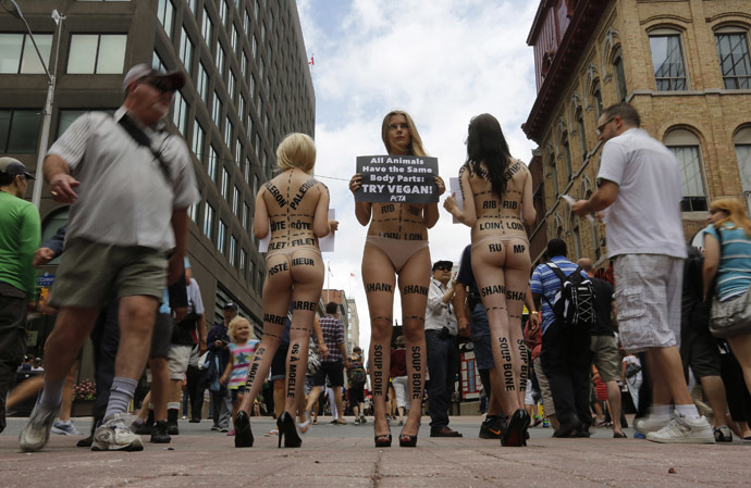 Activists with People for the Ethical Treatment of Animals (PETA) take part in a demonstration in Ottawa June 18, 2014. (Reuters/Chris Wattie)