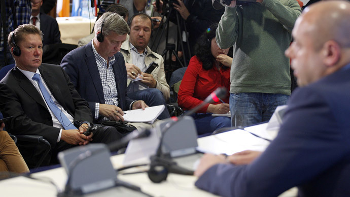 Gazprom CEO Alexey Miller (L) listens as Ukrainian Energy Minister Yuriy Prodan (R) speaks during a press conference after talks on energy security between Ukraine, EU-Commissioner for Energy amd Russian Energy minister on September 26, 2014 in Berlin.(AFP Photo / Odd Andersen)