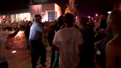 Police officer shot in Ferguson, two suspects at large