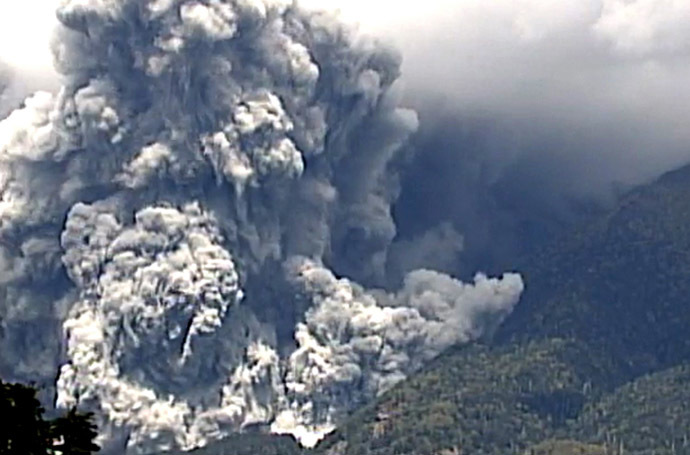 This TV picture released by Japan's Ministry of Land, Infrastructure and Transport Chubu Regional Development Bureau on September 27, 2014 shows the eruption of the Mount Ontake in Nagano prefecture on September 27, 2014. (AFP/Jiji Press)