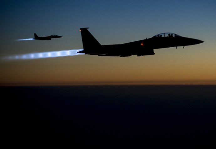 A pair of U.S. Air Force F-15E Strike Eagles fly over northern Iraq after conducting airstrikes in Syria, in this U.S. Air Force handout photo taken early in the morning of September 23, 2014. (Reuters/U.S. Air Force/Senior Airman Matthew Bruch)