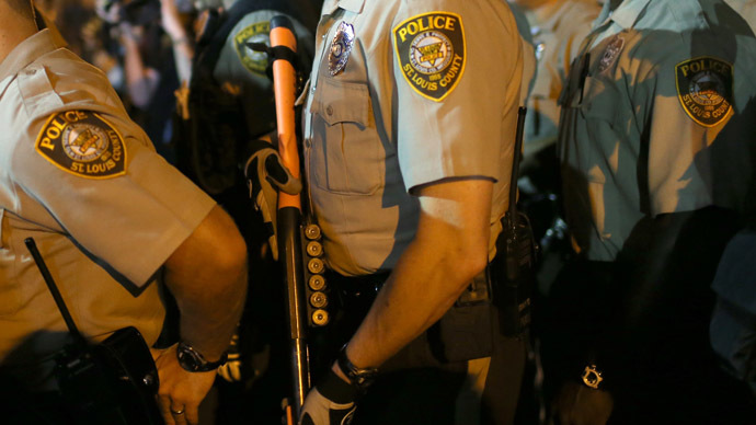 Police officer shot in Ferguson, two suspects at large