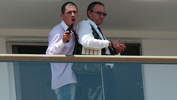 Captor parades his ‘bomb-vest’ wearing hostage in Brazil hotel