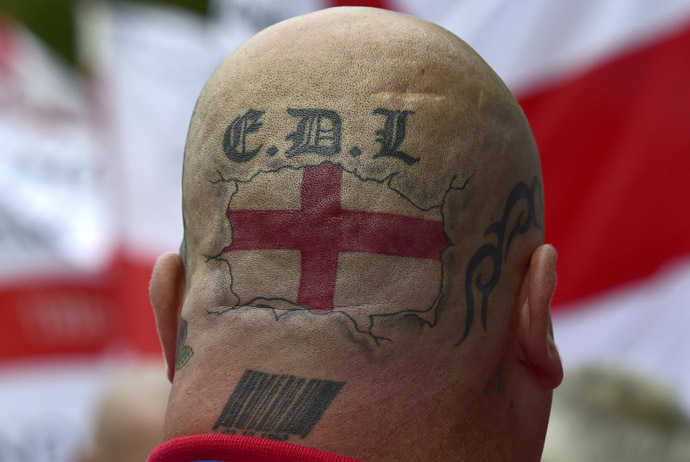 Tattoos are seen on the back of the head of a supporter of the English Defence League (EDL) during a rally outside Downing Street in London September 20, 2014. (Reuters/Toby Melville)