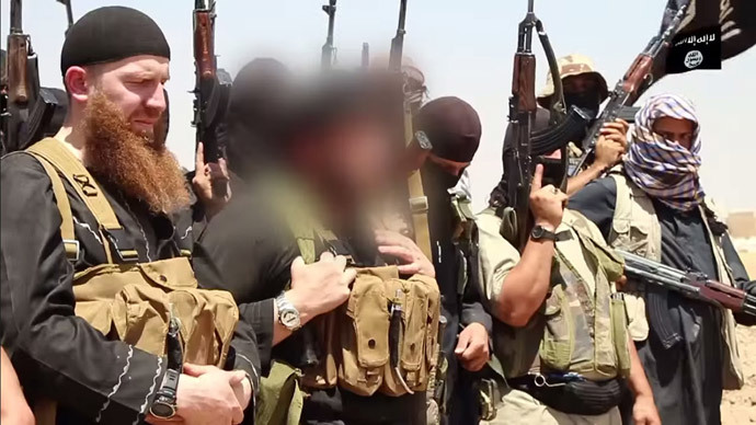 An image made available by Jihadist media outlet al-Itisam Media on June 29, 2014, allegedly shows members of the IS (Islamic state) including military leader and Georgian native, Abu Omar al-Shishani (Tarkhan Batirashvili) (L) and ISIL sheikh Abu Mohammed al-Adnani (C), (AFP Photo / HO / Al-Itisam Media)