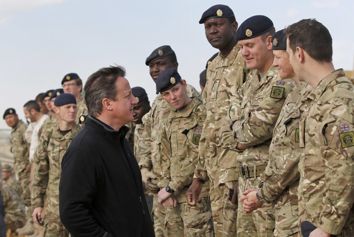 Britain's Prime Minister David Cameron speaks to British soldiers at Camp Bastion, outside Lashkar Gah, in Helmand province, southern Afghanistan December 16, 2013. (Reuters/Lefteris Pitarakis)