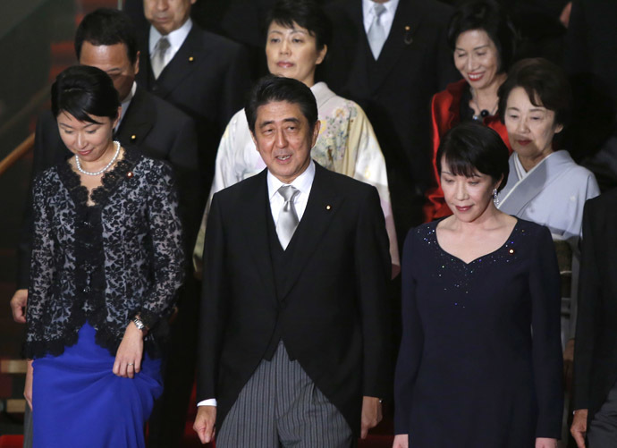 Japan's Prime Minister Shinzo Abe (front C) leads female cabinet ministers as they prepare for a photo session at his official residence in Tokyo September 3, 2014. (Reuters/Yuya Shino)