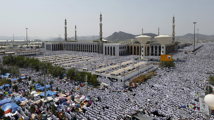 Muslim pilgrims perform Friday prayers around Namirah mosque on the plains of Arafat during the annual haj pilgrimage, outside the holy city of Mecca October 3, 2014. (Reuters//Muhammad Hamed)
