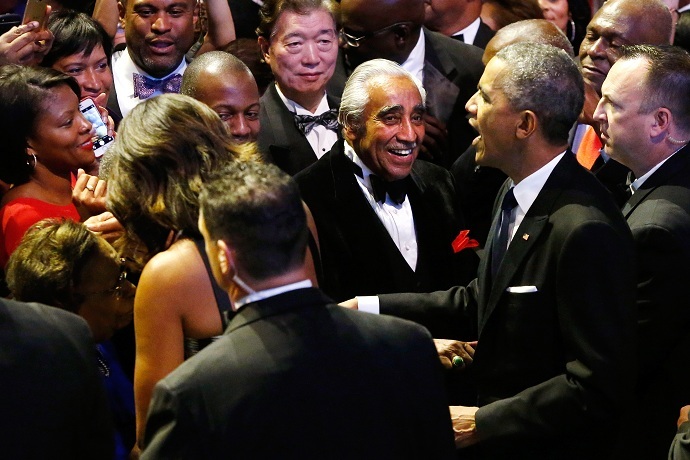 US Rep. Charlie Rangel (D-NY) (C) smiles as President Barack Obama (2nd R) and first lady Michelle Obama (2nd L, back to camera) greet members of the audience at the Congressional Black Caucus Foundation dinner. (Reuters/Jonathan Ernst )