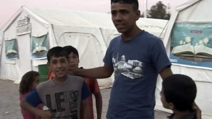 Inside Baharka refugee camp: RT talks to Iraqi survivors of ISIS attacks