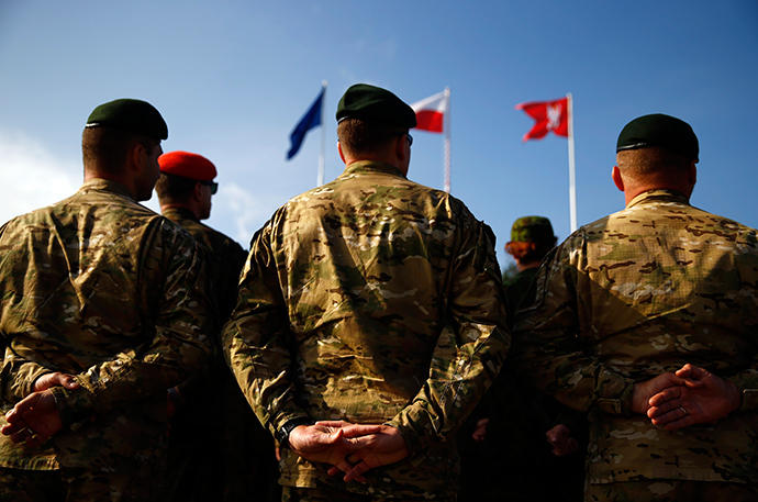 Participants stand during the opening ceremony of "Noble Sword-14" NATO international tactical exercise at the land forces training centre in Oleszno, near Drawsko Pomorskie, northwest Poland September 9, 2014 (Reuters / Kacper Pempel)