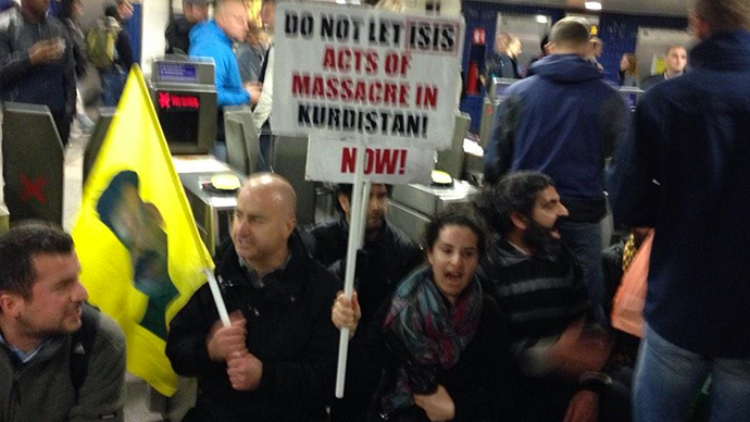 ​'Unite against ISIS!’ Kurds occupy London’s busiest Tube station