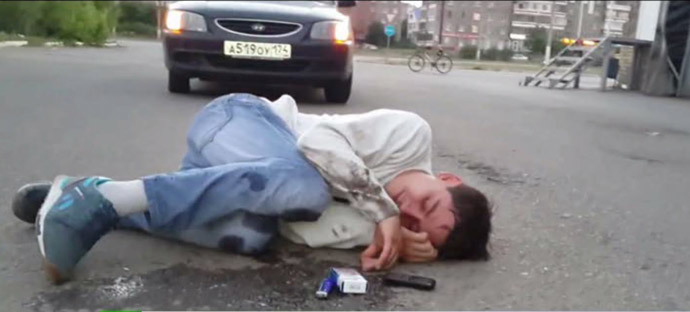 Young man unconscious after inhaling 'spice' fumes. Video still from YouTube